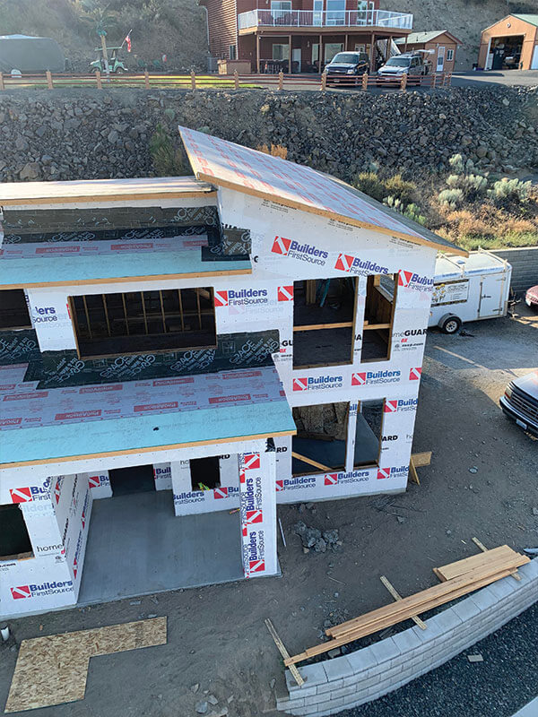 Multi-level new residential build with house wrap installed by Gitter Done Construction in Eastern Washington